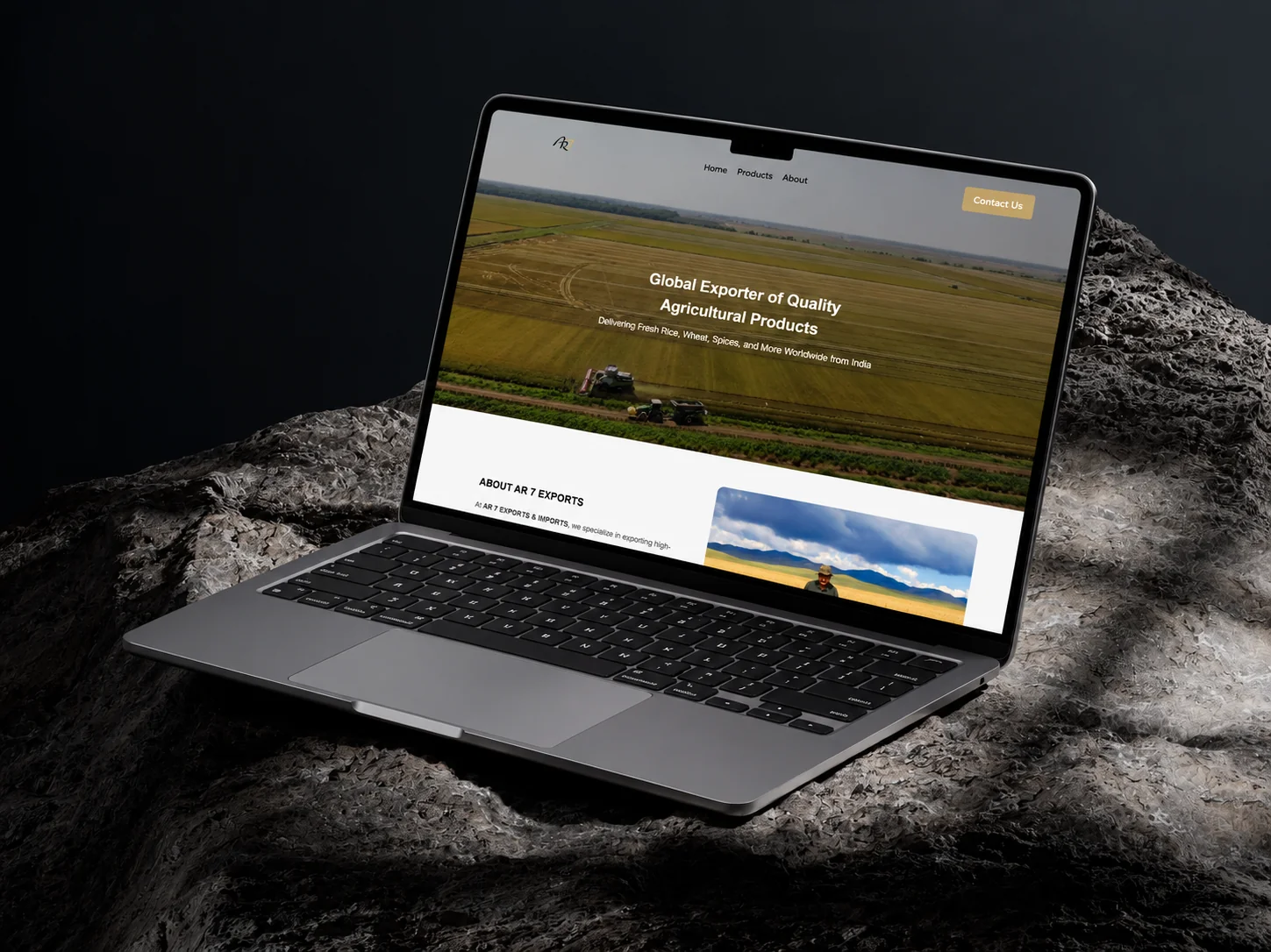 AR 7 Exports website on a laptop: aerial farmland under the headline Global Exporter of Quality Agricultural Products
